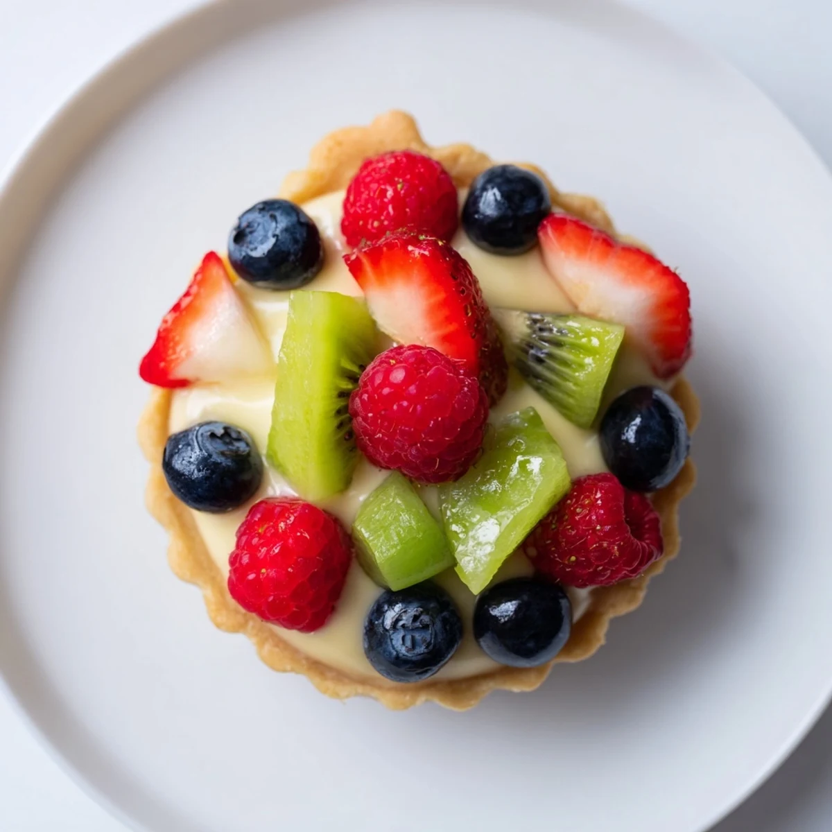 Mini Fruit Tartlets in a Circle Arrangement, with colorful fruit topping, ready to eat.