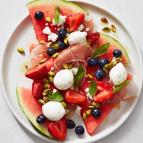 A colorful Watermelon Slice Charcuterie board with juicy watermelon, cheese, and berries.