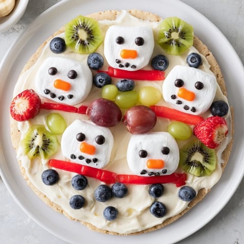 Here are the 3 ALT texts for the "Melting Snowman Fruit Pizza":